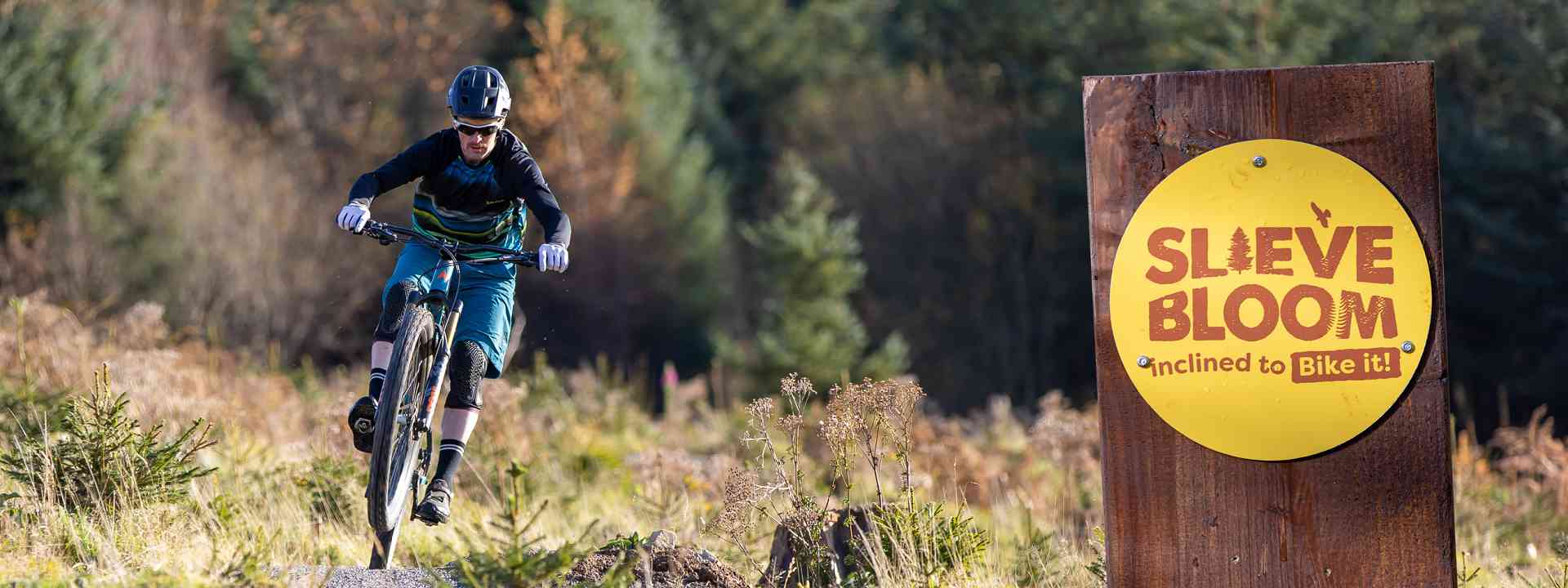 Person mountain biking